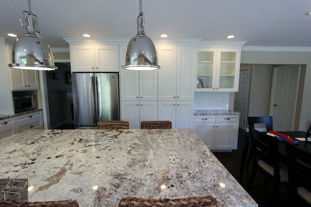 Contemporary U-Shaped Kitchen Remodel with White Custom Cabinets in Irvine